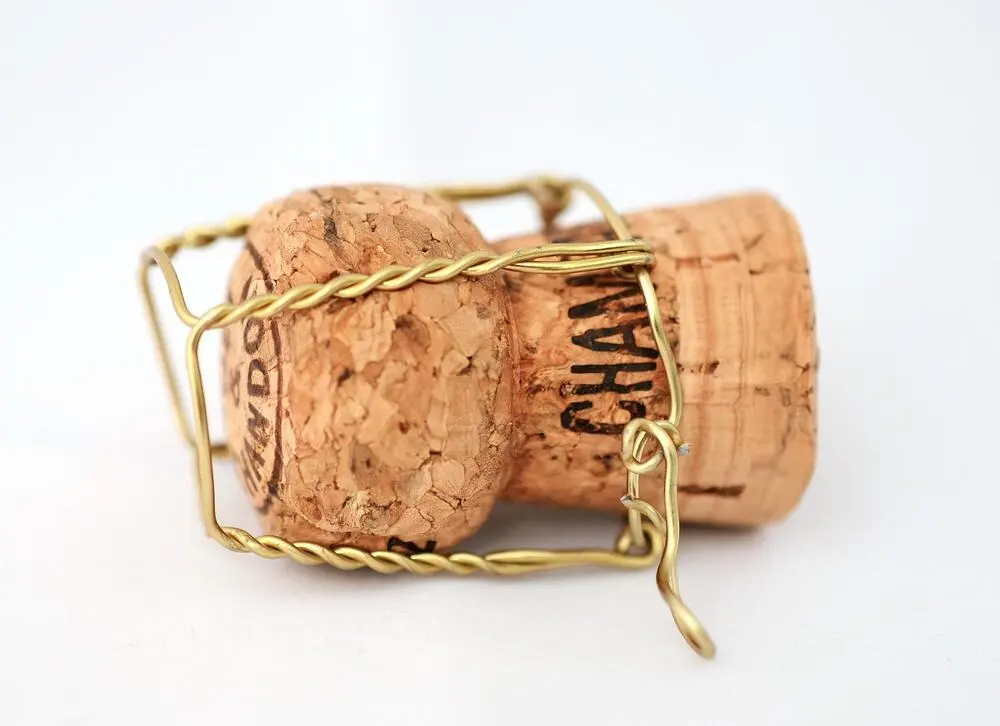 Champagne bottle and cork, a symbol of Cliveden's luxury service
