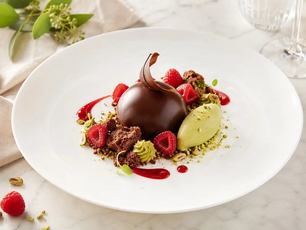 Elegant deconstructed dessert with chocolate and raspberry